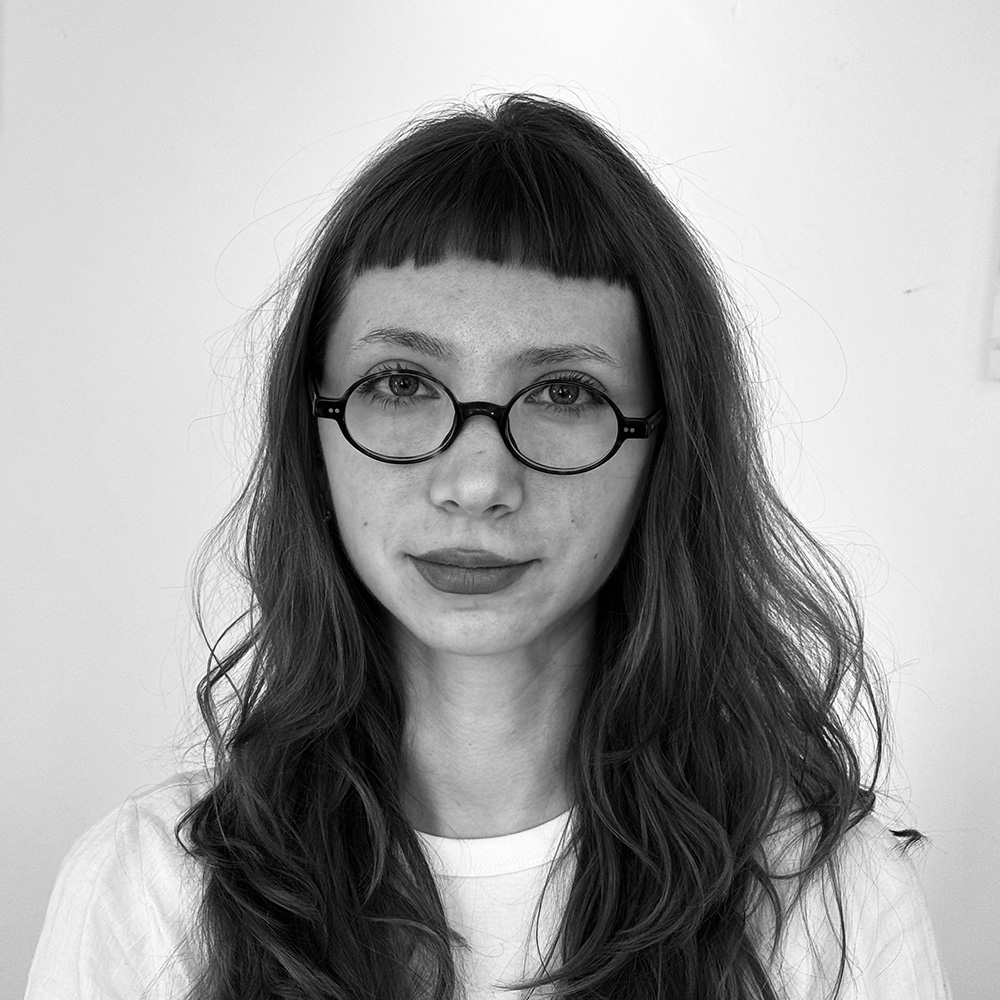 A black and white portrait photo of a student assistant, Zuzanna Barczyk.